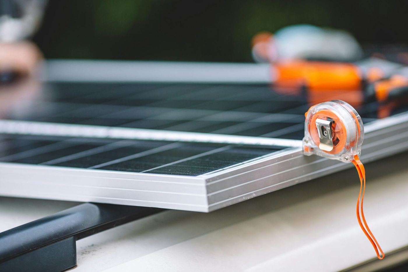 Solar panel on a bench with a tape measure